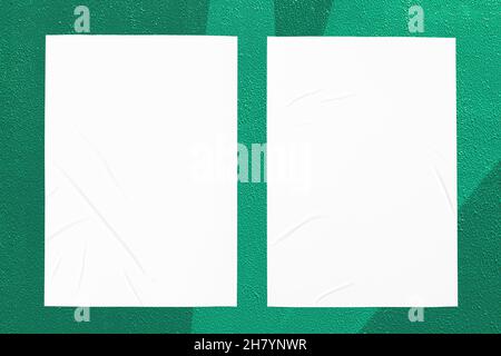 green mint urban wall with two glued posters Stock Photo