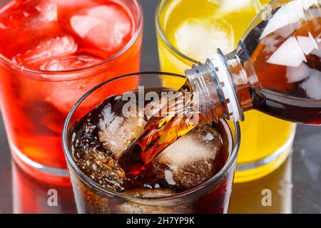 Pouring cola drink drinks lemonade softdrinks in a glass pour Stock Photo