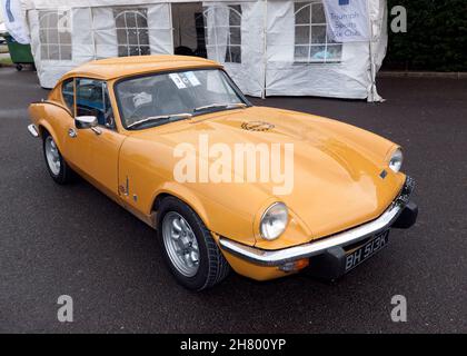 Three-quarter front view of a Yellow, 1972, Triumph Spitfire Mk GT6 Mk3, on display at the 2021 Silverstone Classic Stock Photo