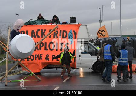 Tilbury Essex, UK. 26th Nov, 2021. Members of Extinction Rebellion block the Amazon distribution centre in Tilbury Essex on Black Friday. Credit: MARTIN DALTON/Alamy Live News Stock Photo