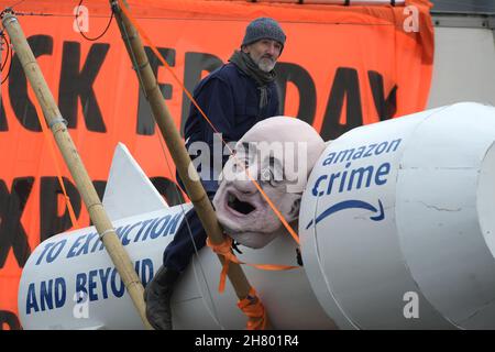 Tilbury Essex, UK. 26th Nov, 2021. Members of Extinction Rebellion block the Amazon distribution centre in Tilbury Essex on Black Friday. Credit: MARTIN DALTON/Alamy Live News Stock Photo