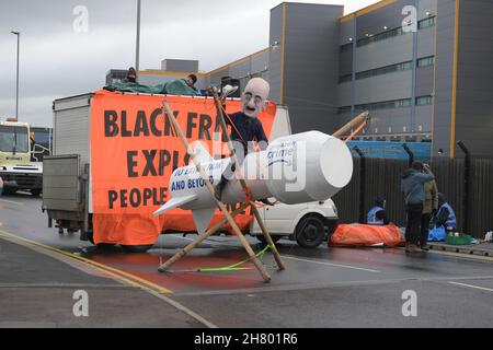 Tilbury Essex, UK. 26th Nov, 2021. Members of Extinction Rebellion block the Amazon distribution centre in Tilbury Essex on Black Friday. Credit: MARTIN DALTON/Alamy Live News Stock Photo