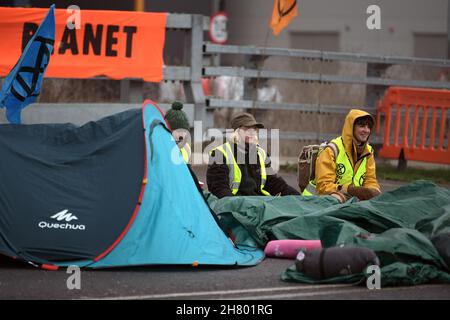 Tilbury Essex, UK. 26th Nov, 2021. Members of Extinction Rebellion block the Amazon distribution centre in Tilbury Essex on Black Friday. Credit: MARTIN DALTON/Alamy Live News Stock Photo