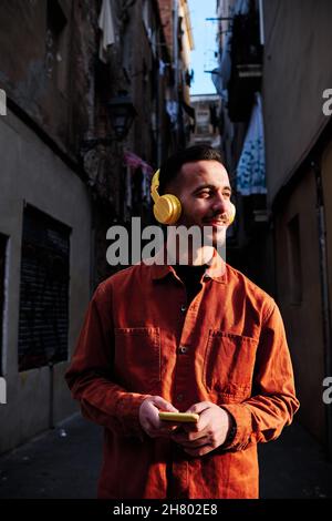 Man using his phone while listening music. Stock Photo