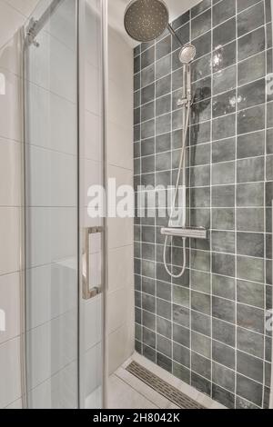 Shower cubicle interior with two shower heads and one transparent shower enclosure Stock Photo