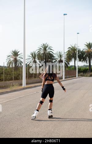 Body Blading Slender anonymous young woman with long brown hair Stock Photo - Alamy