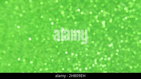 Green White, silver, Christmas background with defocused lights. Background for New Year. White or silver lights on a green background. Banner Stock Photo