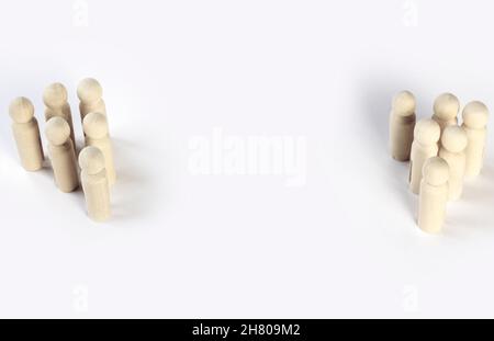 Two different groups of people standing facing to each other for equality and competition in business concept. Stock Photo