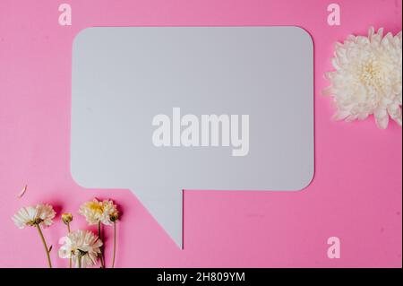 blank speech rectangle with conner rounded and flower on pink background Stock Photo