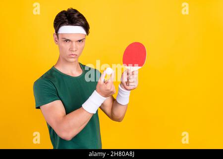 Photo of young charming angry unhappy man hold hands ball tennis game isolated on yellow color background Stock Photo