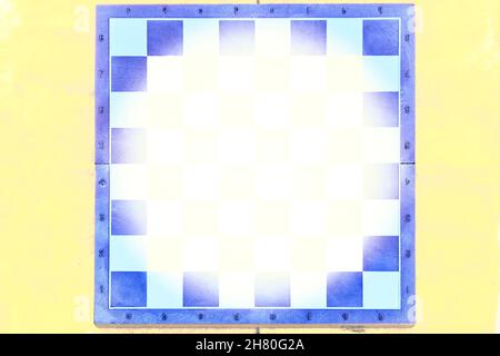 Blue chess board on yellow background with place for text Stock Photo