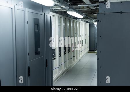 modern data center with rows of closed servers, cyber security concept Stock Photo