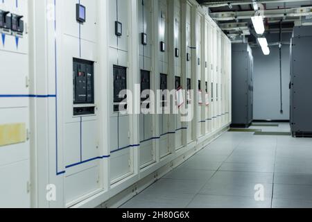rows of closed servers in corridor of data center, cyber security concept Stock Photo