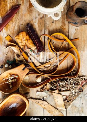 old table with antique tableware and handmade goods Stock Photo