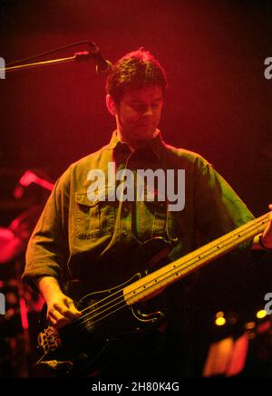 The Stranglers concert, Wembley Arena, London, 26/3/1994 - Jean-Jacques Burnel, bass guitarist, playing live on stage Stock Photo