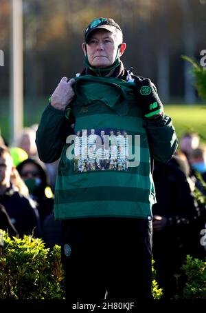 A mourner holds a Celtic shirt with a picture of the 1967 European Cup winning side, nicknamed the Lisbon Lions, during the funeral service of former Celtic player Bertie Auld. Auld, one of Celtic's European Cup heroes, died at the age of 83 on November 14, 2021. The midfielder scored 85 goals in 283 appearances over two spells for Celtic, the most famous game of which was the 1967 European Cup final win against Inter Milan in Lisbon. Picture date: Friday November 26, 2021. See PA story SOCCER Auld. Photo credit should read: Andrew Milligan/PA Wire. RESTRICTIONS: Use subject to restrictions. E Stock Photo