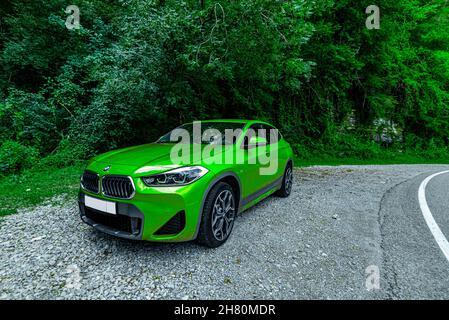 Russia Sochi June 30, 2021. new green BMW x2. crossover outdoors in summer Stock Photo