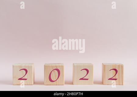 Wooden cubes pyramid with new year numbers Stock Photo