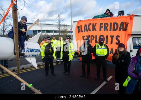 Tilbury, UK. 26th Nov, 2021. TILBURY, ESSEX ,UK 26th NOVEMBER 2021. Extinction Rebellion block the Amazon warehouse in Tilbury on Black Friday as a part of Amazon blockad Credit: Lucy North/Alamy Live News Stock Photo