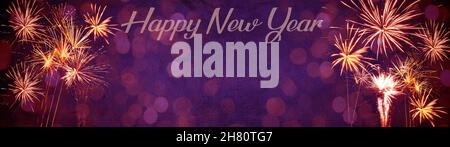 Happy New Year Party Silvester background banner panorama long- Golden yellow firework on rustic purple stone concrete texture, top view with space fo Stock Photo