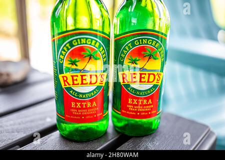 Sugar Mountain, USA - May 31, 2021: Closeup of two glass bottles with sign label for Reed's Craft Ginger beer brand of all natural real ginger ale non Stock Photo