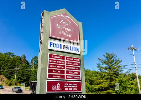 Banner Elk, USA - June 17, 2021: Local store strip mall sign for Food Lion grocery shop in NC North Carolina near Sugar Mountain Village and Subway, C Stock Photo