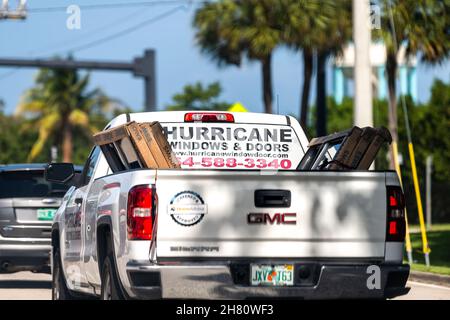 Hollywood, USA - July 8, 2021: Hurricane windows and doors advertisement sign on truck service business company to install shutters against storm in M Stock Photo