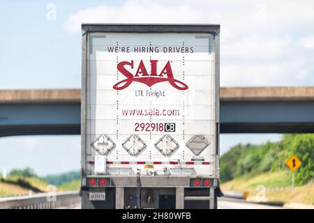 Lexington, USA - May 27, 2021: Highway interstate road in Virginia with truck vehicle for Saia transport and sign for hiring drivers application on on Stock Photo