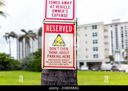 Hollywood, USA - July 13, 2021: Street parking sign with funny humor for don't even think about parking here reserved space on road in Hollywood beach Stock Photo
