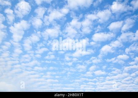 Blue sky with multitude small clouds , may be used as background or texture Stock Photo