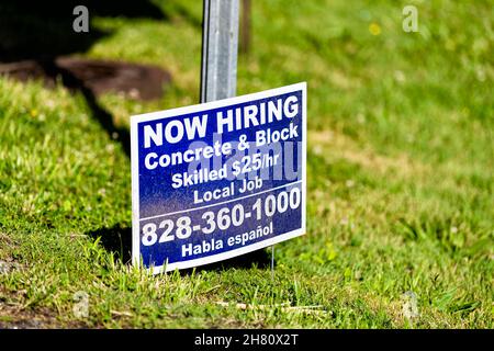 Banner Elk, USA - June 23, 2021: Banner Elk city small town village in North Carolina with sign phone number for now hiring during job shortage for sk Stock Photo