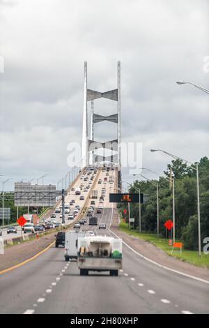 Jacksonville, USA - July 6, 2021: Highway i295 road in Jacksonville, Florida and cars traffic to Dames Point suspension cable-stayed bridge over St. J Stock Photo