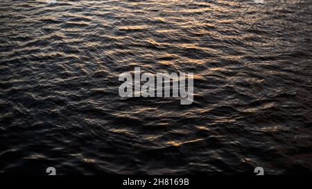 An abstract closeup of a shallow disturbance on water surface Stock Photo