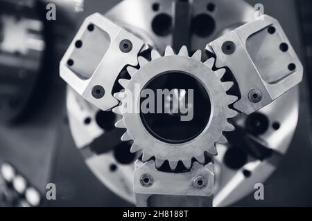 Industrial background, close-up gear metal wheels monochrome color. Stock Photo