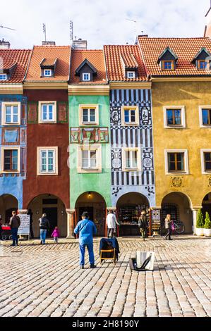 POZNAN, POLAND - Nov 12, 2018: A row of colorful buildings at the old market square with people, Poznan, Poland Stock Photo
