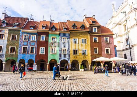 POZNAN, POLAND - Nov 12, 2018: A row of colorful buildings at the old market square with people, Poznan, Poland Stock Photo