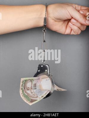 debentures, woman banknote and hand in handcuffs and a money debt... Stock Photo