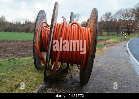 Two fiber optic conduit reels with speed pipes in a rural area near Petershagen (Germany) Stock Photo