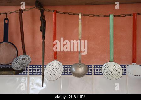 Display or Collection of Vintage Ladles in Retro Kitchen Stock Photo