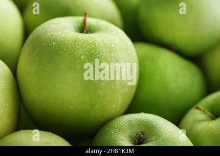 Premium Photo  Ripe and juicy green apples with dew drops.