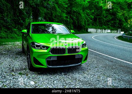 Russia Sochi June 30, 2021. new green BMW x2. crossover outdoors in summer Stock Photo