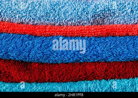 stack of colored towels full frame close-up background Stock Photo