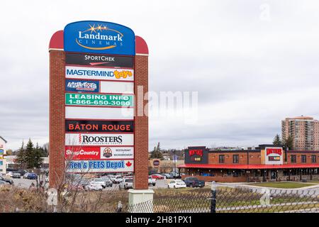 Signage listing stores and businesses near shopping mall in Kanata, Canada Stock Photo