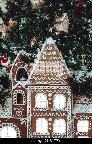 Christmas decoration Gingerbread house and the Christmas tree. New year magic decoration Stock Photo