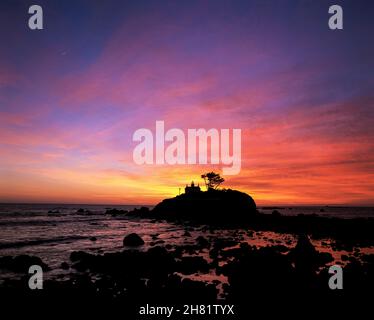 Battery Point Lighthouse, sunset light on coast, Crescent City, California, Northern California Stock Photo