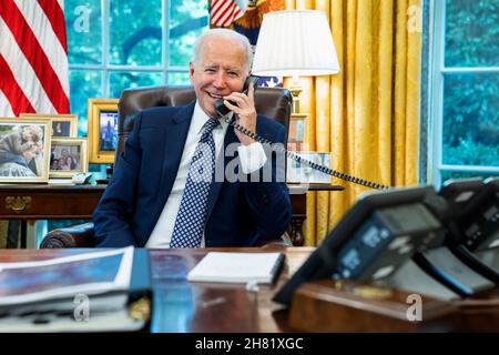 WASHINGTON DC, USA - 24 August 2021 - US President Joe Biden talks on the phone with House Speaker Nancy Pelosi, D-Calif., Tuesday, Aug. 24, 2021, in Stock Photo