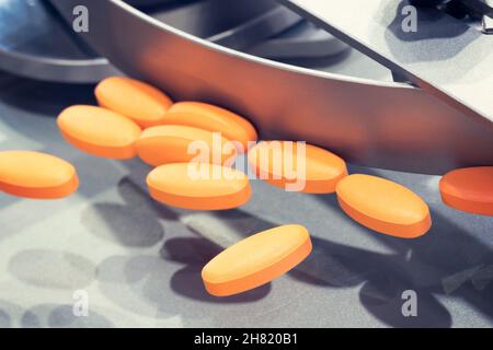 Pharmaceutical production line, production of tablets or vitamins manufacturing, tablet conveyor Stock Photo