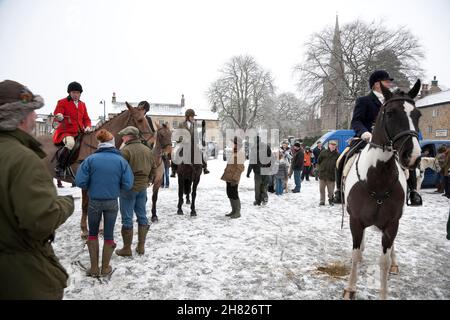 Masham, North Yorkshire, England, United Kingdom | December 27, 2010: A snowy Boxing Day Hunt meeting in Masham, with people on horses
