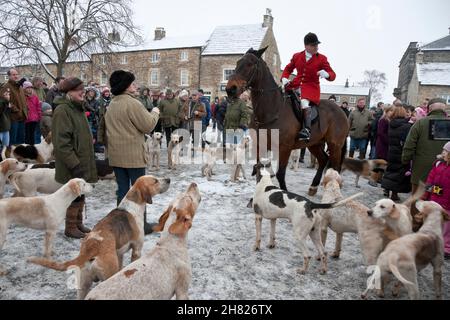 Masham, North Yorkshire, England, United Kingdom | December 27, 2010: A snowy Boxing Day Hunt meeting in Masham, with people on horses