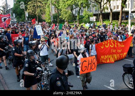 Toronto, Ontario, Canada - 06/25/2010 : Police used bicycles to control thousands of activists marching along University Avenue in a protest ahead of Stock Photo